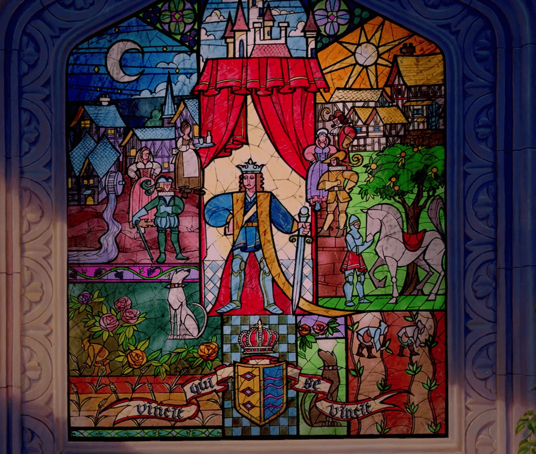 The stained glass over Beast's castle in the 90s version of Beauty and the Beast, with the motto vincit qui se vincit.